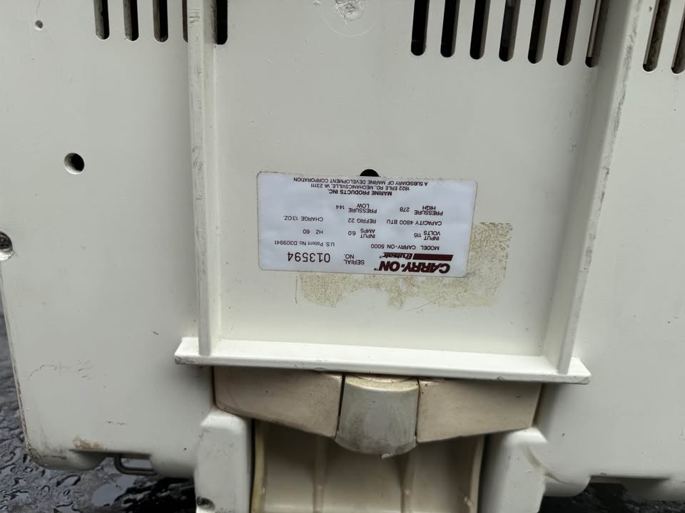 Portable, marine air conditioner with cover.