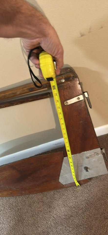 a wooden sailboat rudder and tiller assembly