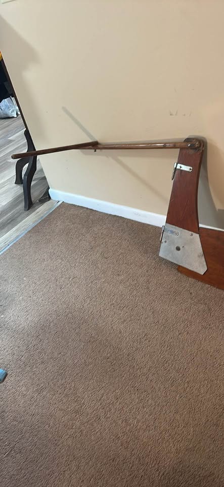 a wooden sailboat rudder and tiller assembly