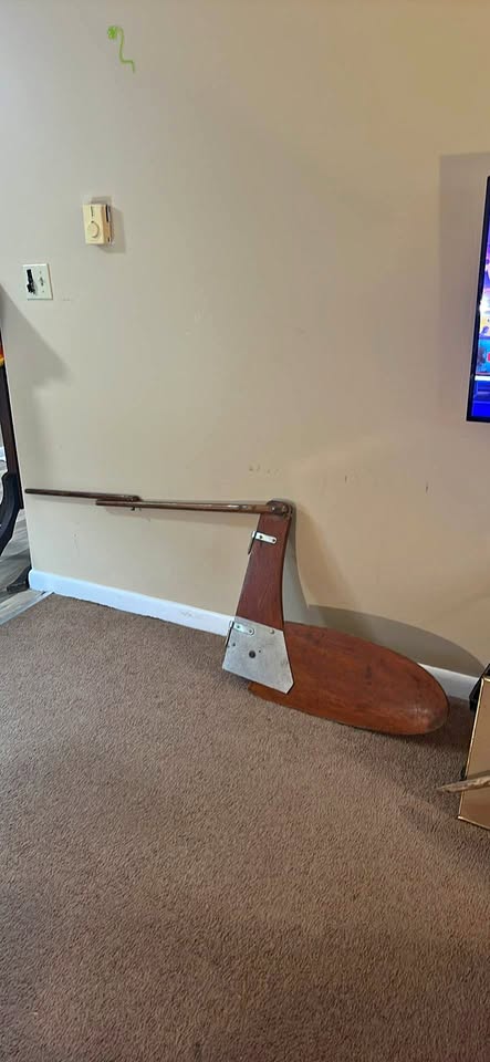 a wooden sailboat rudder and tiller assembly